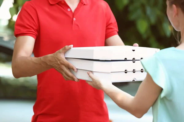Young Man Giving Pizza Boxes Woman Outdoors Food Delivery Service — Stock Photo, Image