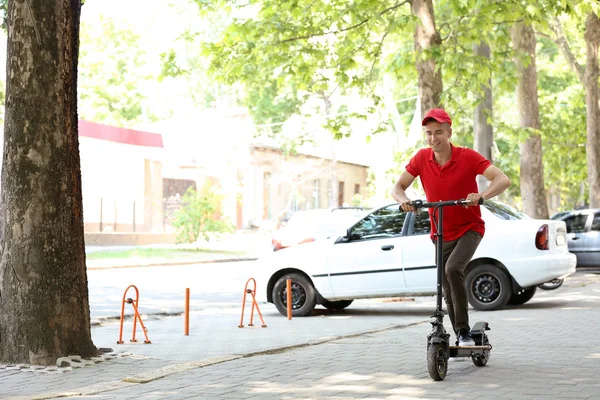 Young Man Riding Kick Scooter Outdoors — Stock Photo, Image