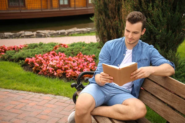 Young Man Reading Book While Sitting Wooden Bench Park — Stock Photo, Image