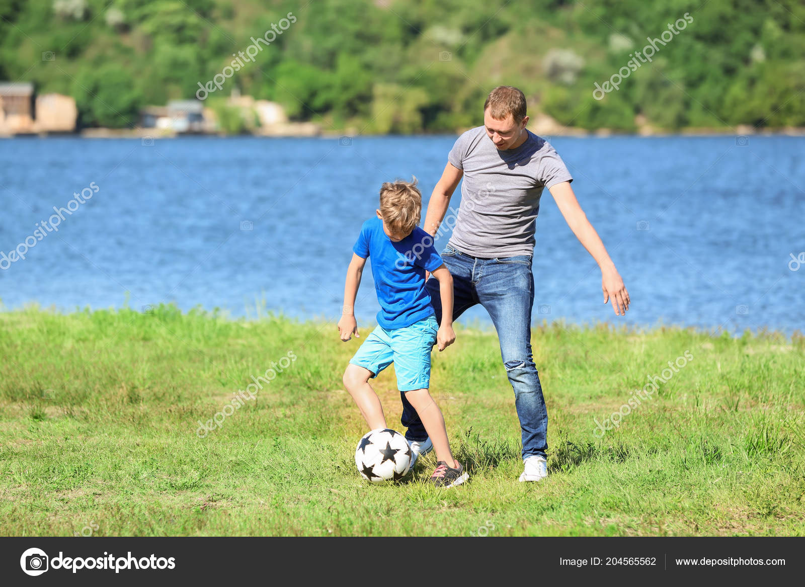 Happy Father Son Playing Football River Stock Photo by ©serezniy 204565562
