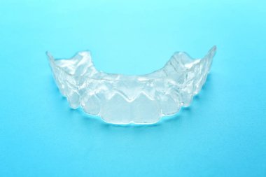 Occlusal splint on color background clipart