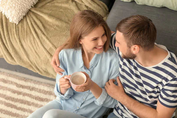 Happy Young Couple Drinking Hot Coffee While Resting Home — Stock Photo, Image