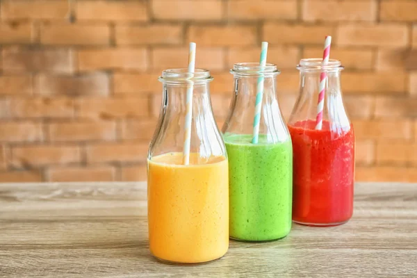 Bottles Fresh Tasty Smoothies Wooden Table — Stock Photo, Image