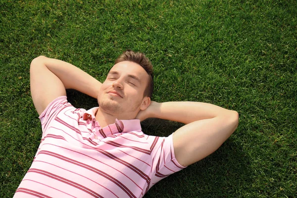 Young Man Relaxing Green Grass Outdoors Royalty Free Stock Photos