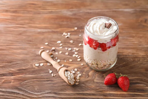 Tasty Oatmeal Dessert Strawberries Glass Jar Wooden Background — Stock Photo, Image