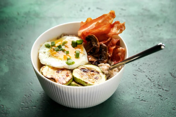 Bowl Tasty Oatmeal Fried Egg Mushroom Squash Color Background — Stock Photo, Image