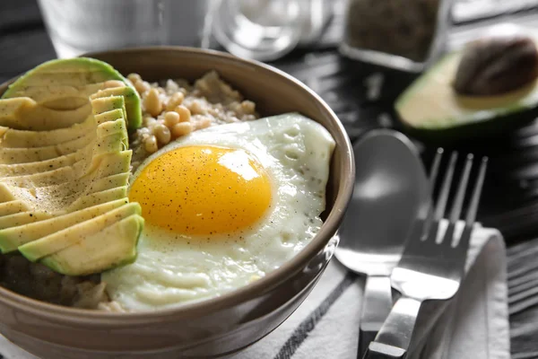 Bowl Delicious Oatmeal Egg Avocado Table Closeup — Stock Photo, Image