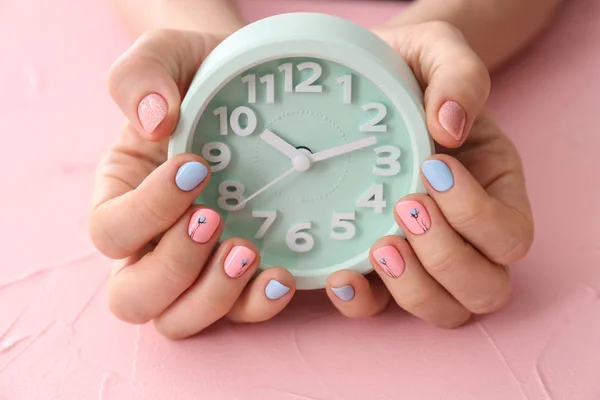 Woman Stylish Color Nails Holding Alarm Clock Pink Background Closeup — Stock Photo, Image