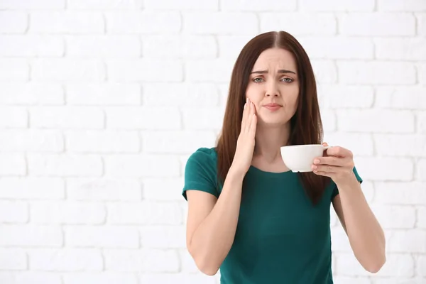 Young Woman Sensitive Teeth Cup Hot Coffee Brick Wall Background — Stock Photo, Image