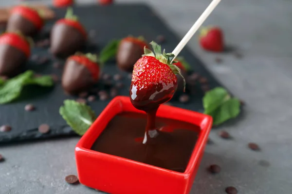 Dipping Tasty Strawberry Melted Chocolate — Stock Photo, Image