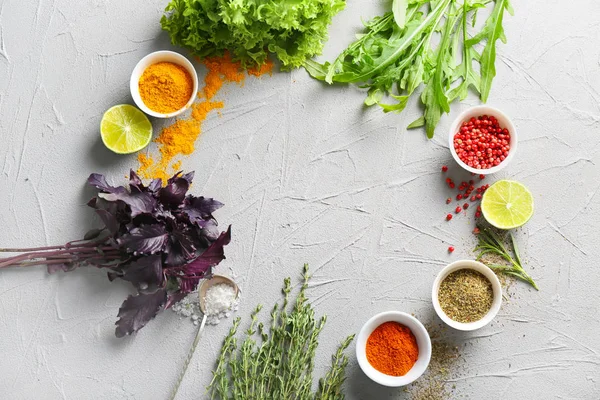 Composition with fresh herbs and spices on textured background