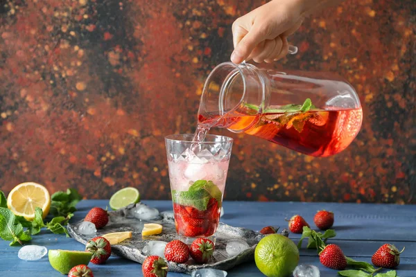 Woman Pouring Tasty Strawberry Lemonade Glass Table — Stock Photo, Image