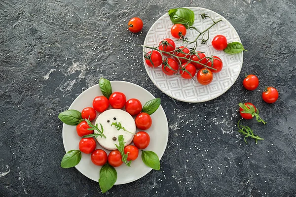 Plates Fresh Cherry Tomatoes Cheese Grey Background — Stock Photo, Image