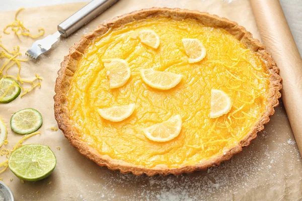 Delicious lemon pie on table