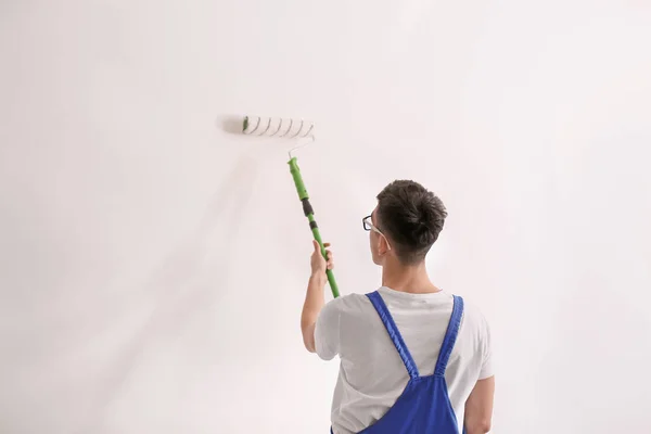 Male Decorator Painting Wall Roller Indoors — Stock Photo, Image