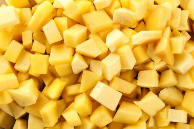 Arka plan olarak taze olgun mango parçaları