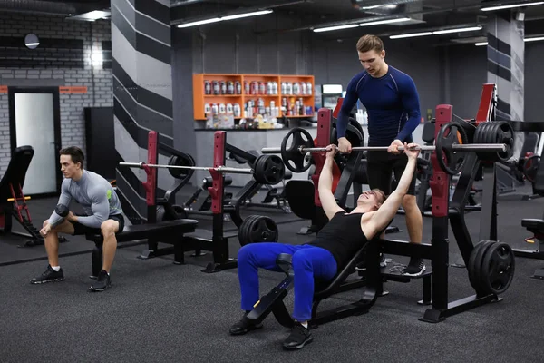 Personal Trainer Helping Young Man Who Working Out Gym — Stock Photo, Image