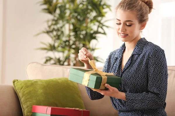 Beautiful Young Woman Opening Gift Box Home — Stock Photo, Image