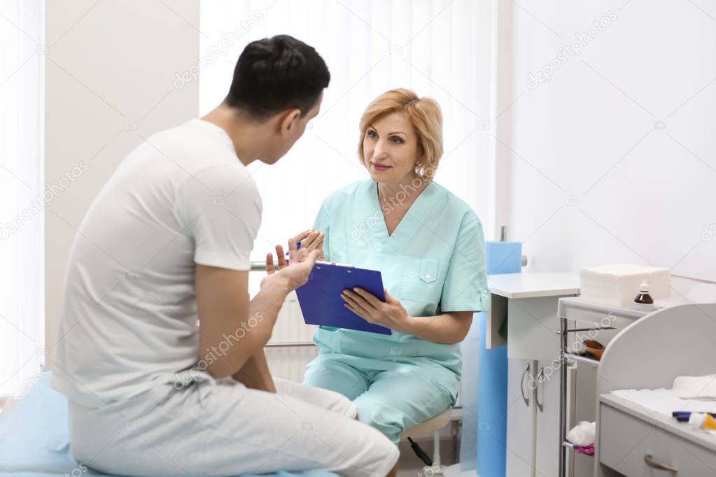 Man visiting doctor in hospital