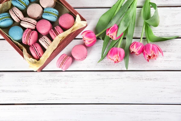 Crate Tasty Macarons Tulips Wooden Background Top View — Stock Photo, Image