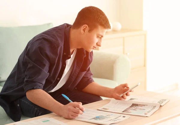 Young Man Searching Classifieds Newspaper Home — Stock Photo, Image