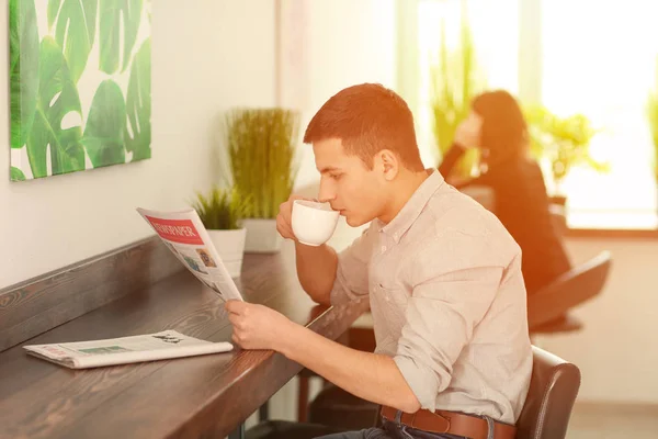 Handsome Young Man Reading Newspaper While Drinking Coffee Cafe — Stock Photo, Image