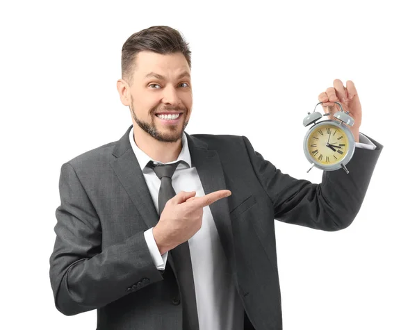 ホワイトを背景に目覚まし時計を持つビジネスマン 時間管理の考え方 ストック写真