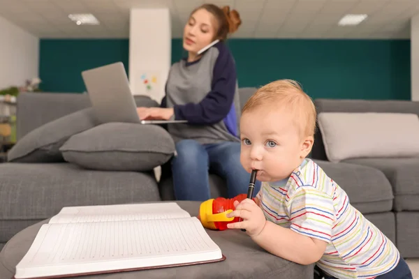 Cute Little Baby Playing Notebook While Mother Working Home — Stock Photo, Image