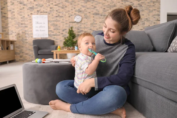 Young Mother Holding Baby While Working Home — Stock Photo, Image