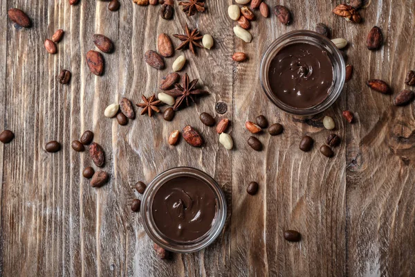 Bowls Molten Chocolate Nuts Beans Wooden Table — Stock Photo, Image