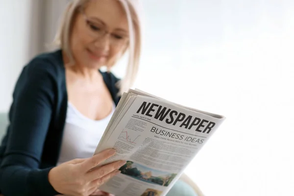 Mature Woman Reading Newspaper Home — Stock Photo, Image