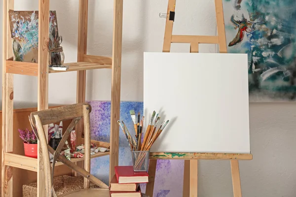 Clean canvas on easel in artist\'s studio