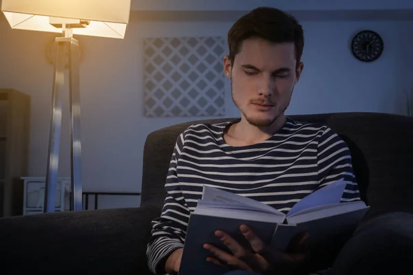 Young Man Reading Book Evening Home — Stock Photo, Image