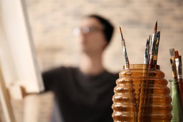 Set Paintbrushes Vase Blurred Artist Background — Stock Photo, Image