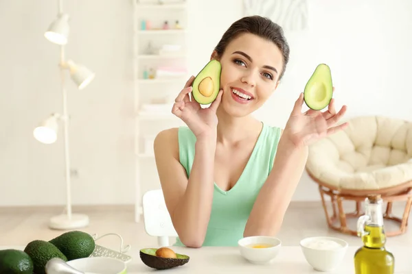 Young Woman Making Nourishing Mask Avocado Kitchen — Stock Photo, Image