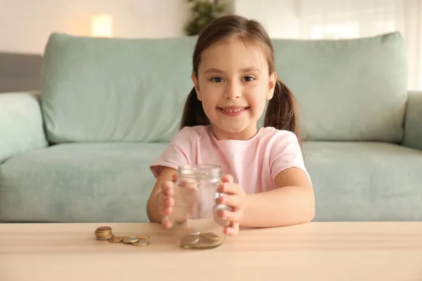 Little Girl Glass Jar Money Savings Indoors — Stock Photo, Image