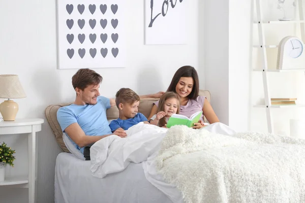 Happy Family Reading Book Together Bedroom — Stock Photo, Image