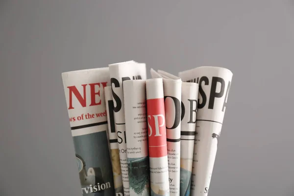 Newspapers Grey Background — Stock Photo, Image