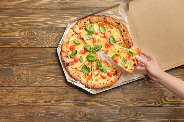 Young Woman Taking Slice Delicious Pizza Margherita Carton Box Table — Stock Photo, Image