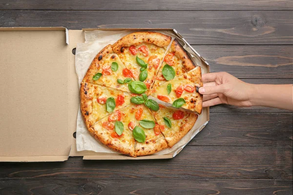Young Woman Taking Slice Delicious Pizza Margherita Carton Box Table — Stock Photo, Image