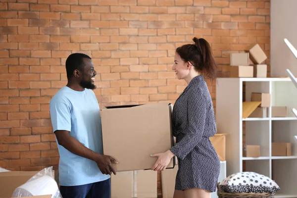 Interracial Couple Holding Box Indoors Moving New House — Stock Photo, Image