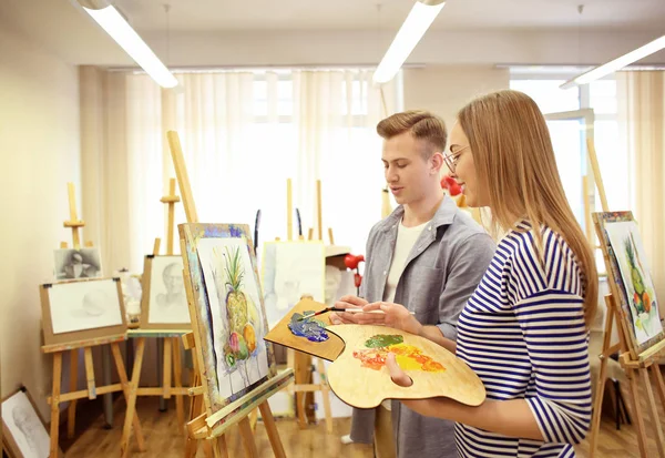 Art students painting in workshop