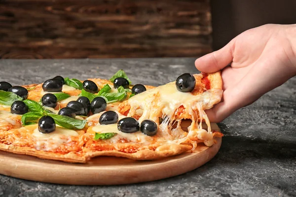 Woman Taking Slice Tasty Pizza Olives Table — Stock Photo, Image