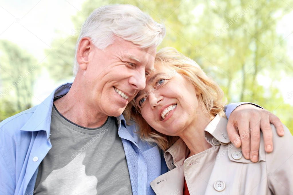 Mature couple in park on spring day