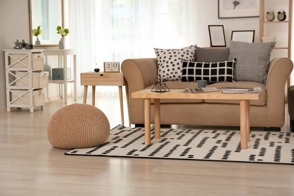 Stylish interior of living room with sofa and table — Stock Photo, Image