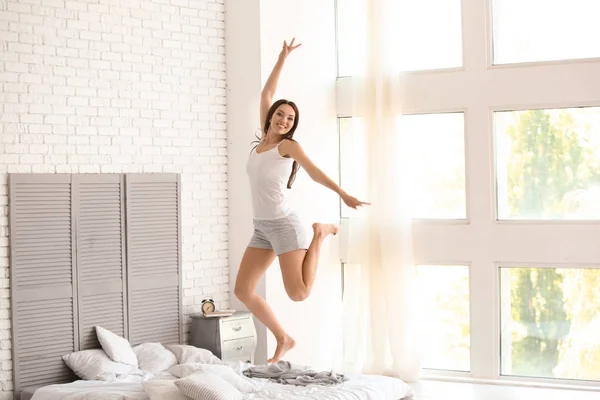 Beautiful Young Woman Jumping Bed Home — Stock Photo, Image