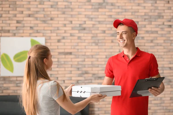 Young Man Giving Pizza Boxes Woman Indoors Food Delivery Service — Stock Photo, Image