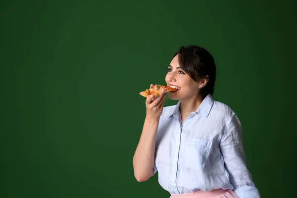 Young Woman Eating Slice Hot Tasty Pizza Color Background — Stock Photo, Image