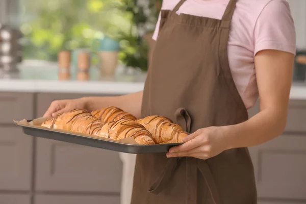 Young Woman Holding Baking Tray Fresh Croissants Indoors — Stock Photo, Image