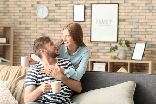 Happy Young Couple Drinking Hot Coffee While Resting Home — Stock Photo, Image